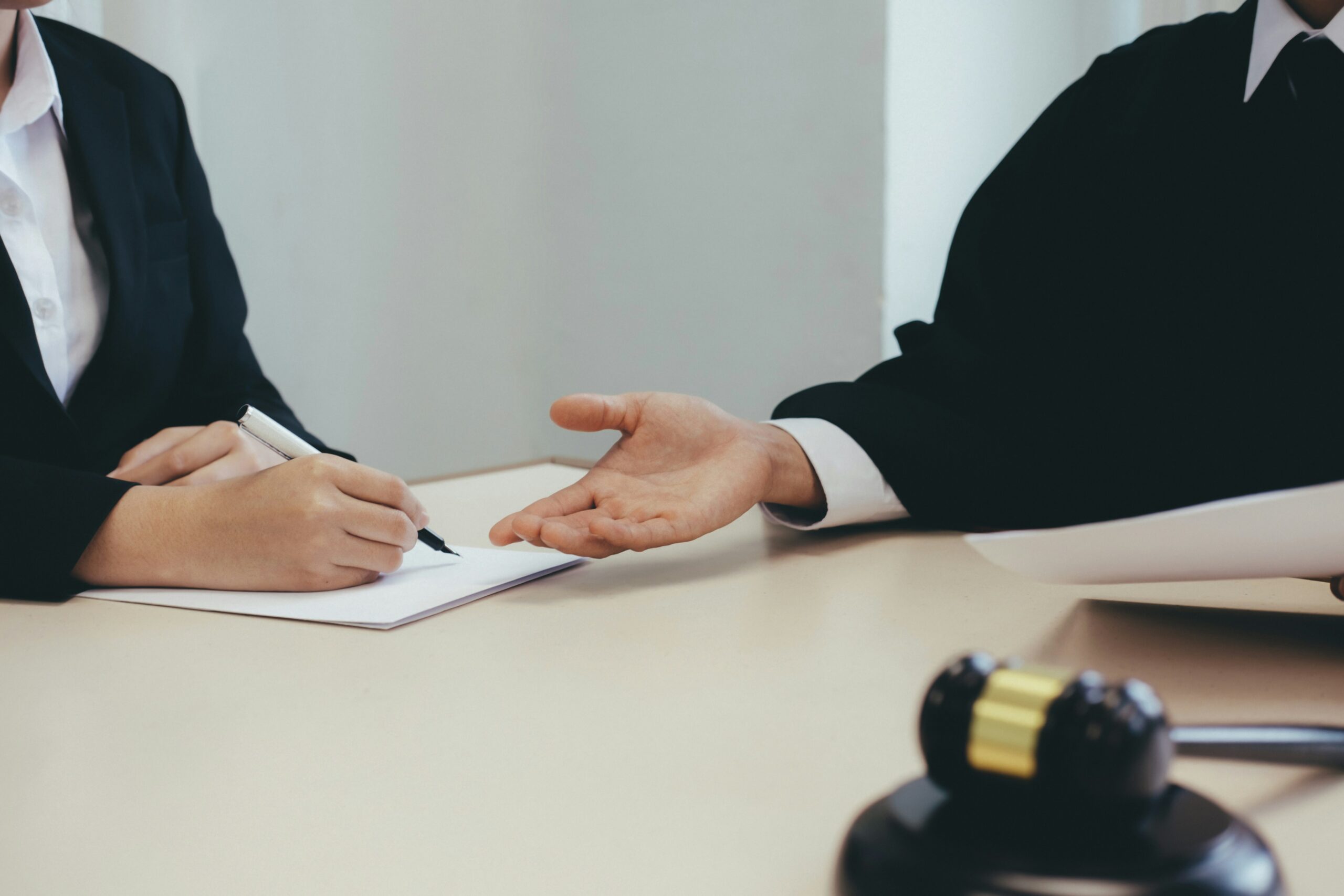 lawyer and client working on paperwork
